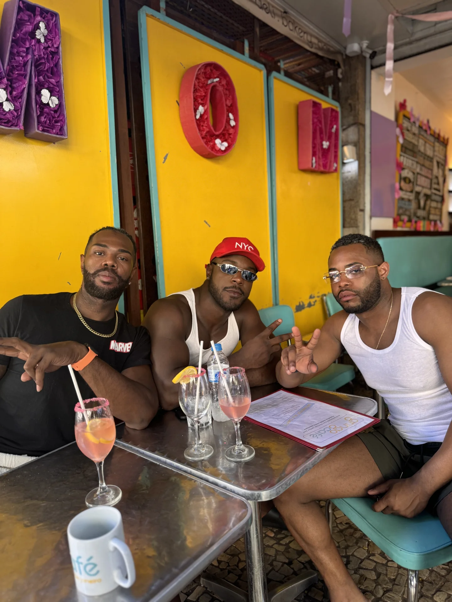 Local cafe in Rio de Janeiro with pink drinks and yellow walls