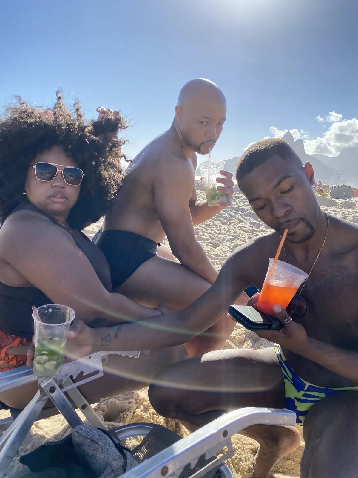 Friends with caipirinhas on Rasta Beach, Leme, Rio de Janeiro